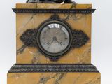 an image of a statue of a man with a clock in his hand
