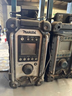 two radio ' s sitting on a table in a room