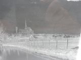 a black and white photo of a church in the snow