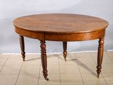 a wooden table with two legs and a round top