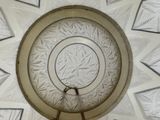 a glass plate with a circular design on it