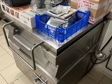 a table with a bunch of items on it in the kitchen