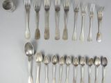 a lot of silver spoons and spoon spoons on a table