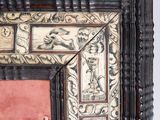 an old picture frame with a picture of a man and a woman on it