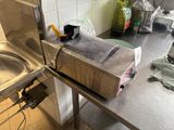 a box sitting on top of a table in a kitchen