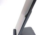 a cell phone that is sitting on top of a stand