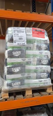 a large stack of packages on a shelf in a store