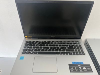 a laptop computer sitting on top of a desk