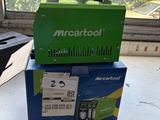 a green box sitting on top of a window sill