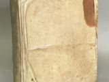an old book that is sitting on a table