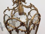a close up of a light fixture hanging from a ceiling