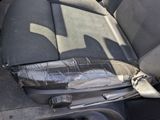 the interior of a car with a seat belt and a seat belt in it