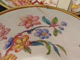 a close up of a plate with a bird on it
