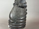 an image of a statue of a woman with a hat on her head