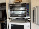 a white microwave oven sitting on top of a counter