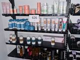 a shelf with many different types of beauty products on it