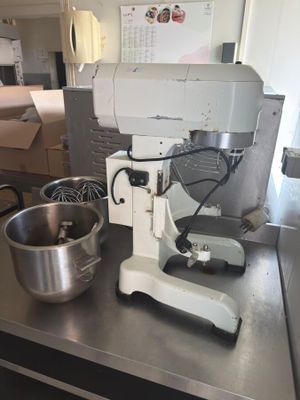 an image of a kitchen counter with a mixer and a bowl
