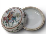 a white box with a picture of a man riding a horse on it