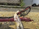 a bike that is attached to a pole in the dirt