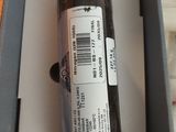 a bottle of liquor in a box with a barcode on it