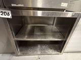 a stainless steel cabinet with a shelf in the middle of it