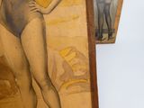 a painting of a woman in a bathing suit hanging on a wall