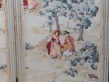 a picture of a room divider with a painting on it