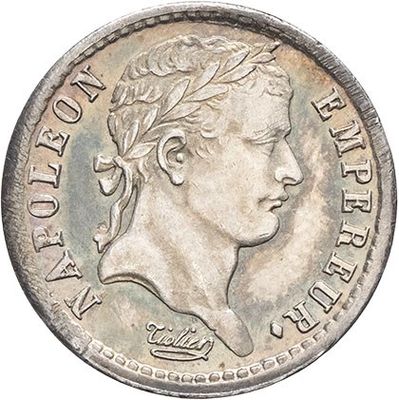 a close up of a coin with a woman ' s face on it