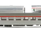 a train that is sitting on the tracks in front of other train cars