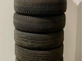 a stack of tires sitting on a pallet on the floor