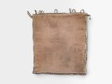 an old burlock bag with a rope hanging from it ' s side