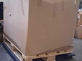 a large box sitting on a pallet in a warehouse