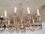 a chandelier that is hanging from the ceiling