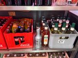 many bottles of soda and bottles of soda on the shelves