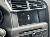 a close up of a radio in a car ' s dashboard