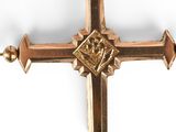 a gold cross with a crown on it