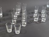 a lot of glasses that are sitting on a table