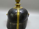 a black and gold box with a gold handle