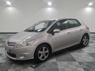 a picture of a silver toyota prius parked on a checkered floor
