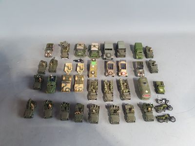 a lot of toy army vehicles that are on the table