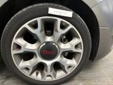 a close up of a car tire with a sticker on it