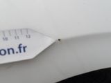 a close up of a sticker on a car ' s bumper