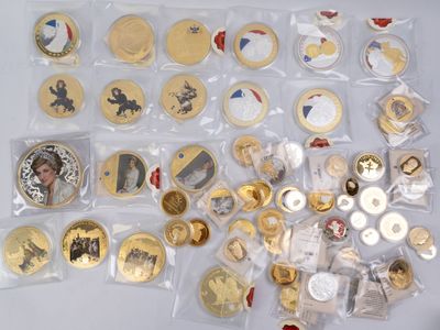 a lot of gold and silver coins on the table