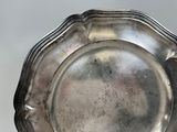 a silver plate that is sitting on a table