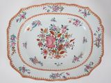 a plate with flowers on it sitting on a table