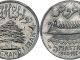 a close up of a coin with a picture of a boat on it