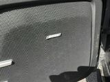 a close up of a speaker in a car door
