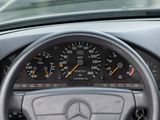 steering wheel of a car with a speedometer and gauges on it