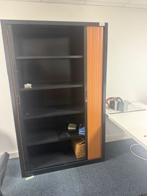 an image of a room with a desk and a bookcase