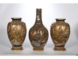 three vases that are sitting on a table